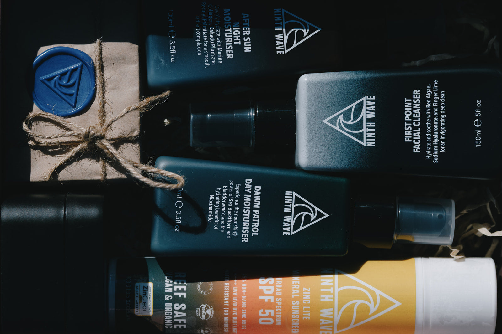 Close-up of Ninth Wave Skin Co. product range arranged together