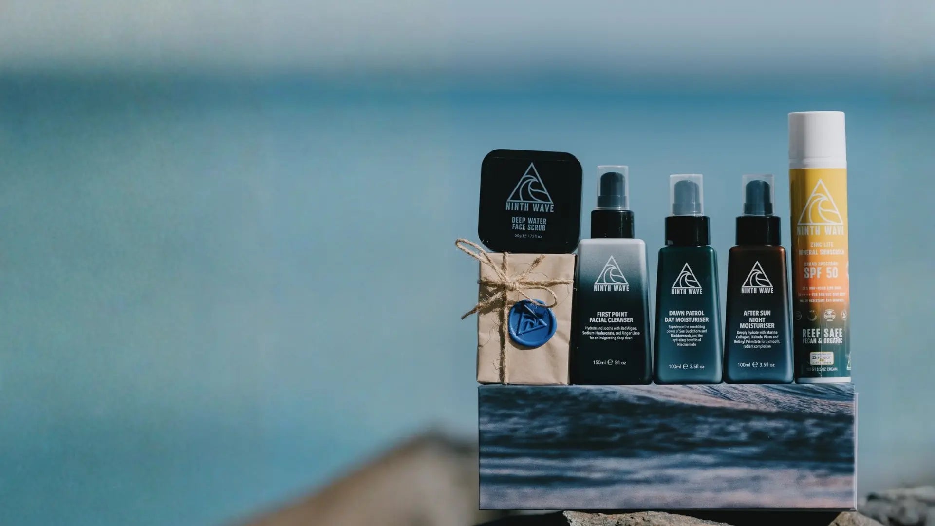 Close-up of Ninth Wave product tube and box showing logo and packaging design